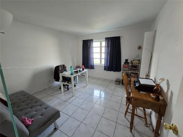 a view of a hallway with washer and dryer