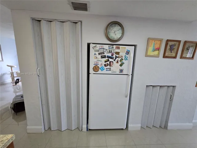 a lobby with furniture and a potted plant