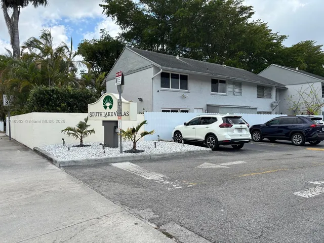 a view of car parked in front of house
