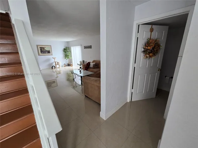 a bathroom with a sink mirror and toilet