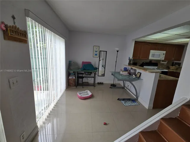 a living room with furniture and a clock