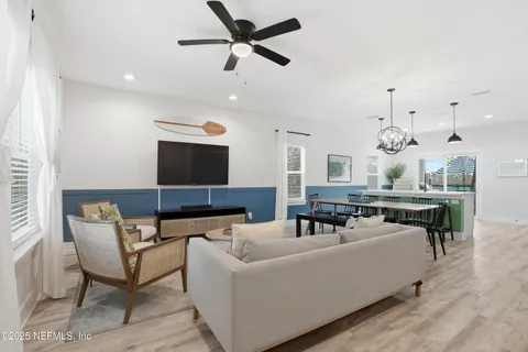 a living room with furniture and a clock