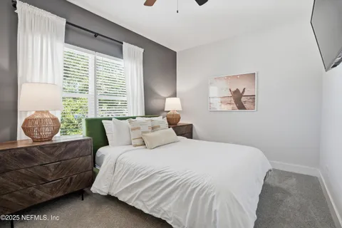 a bedroom with a bed and couch