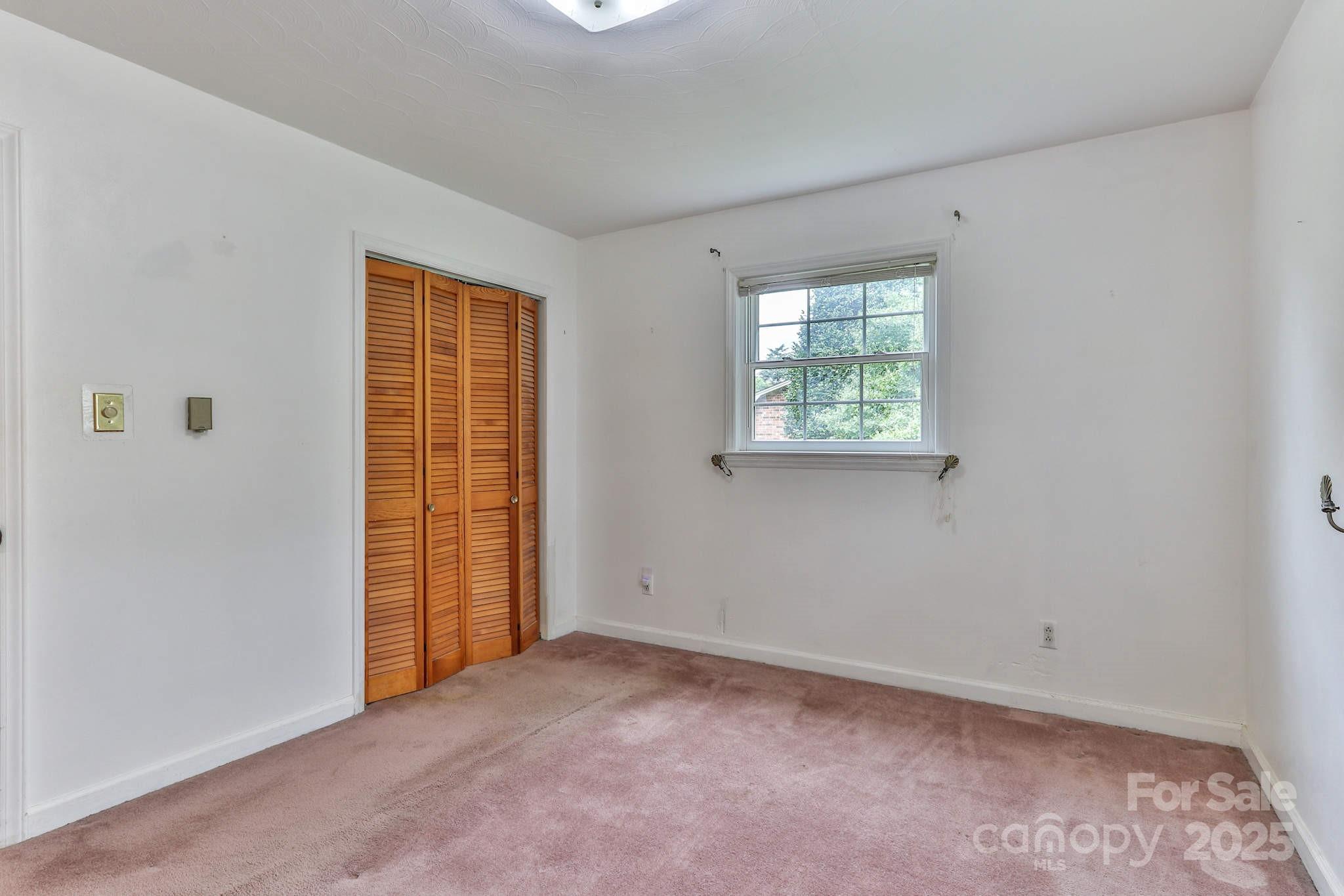 554 Wildlife Access Road Hickory, NC 28601 - Photo 15 of 34 an empty room with windows