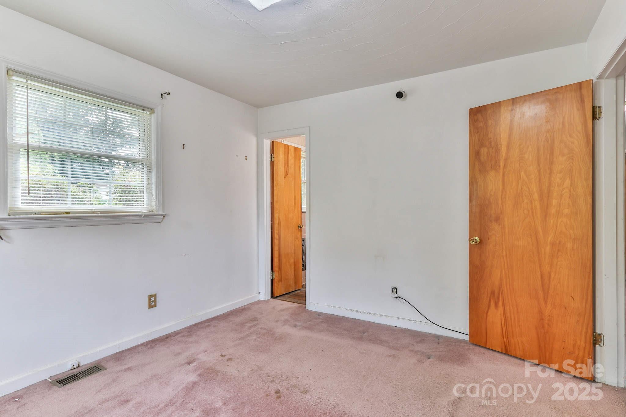 554 Wildlife Access Road Hickory, NC 28601 - Photo 17 of 34 a view of an empty room with a window