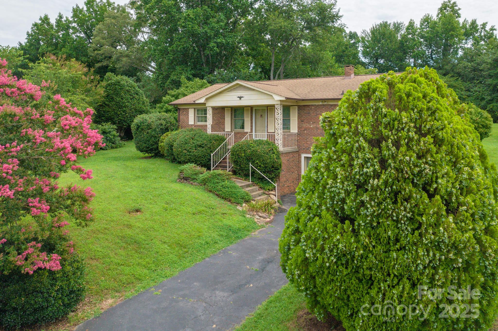 554 Wildlife Access Road Hickory, NC 28601 - Photo 2 of 34 a view of a house with a yard and garden