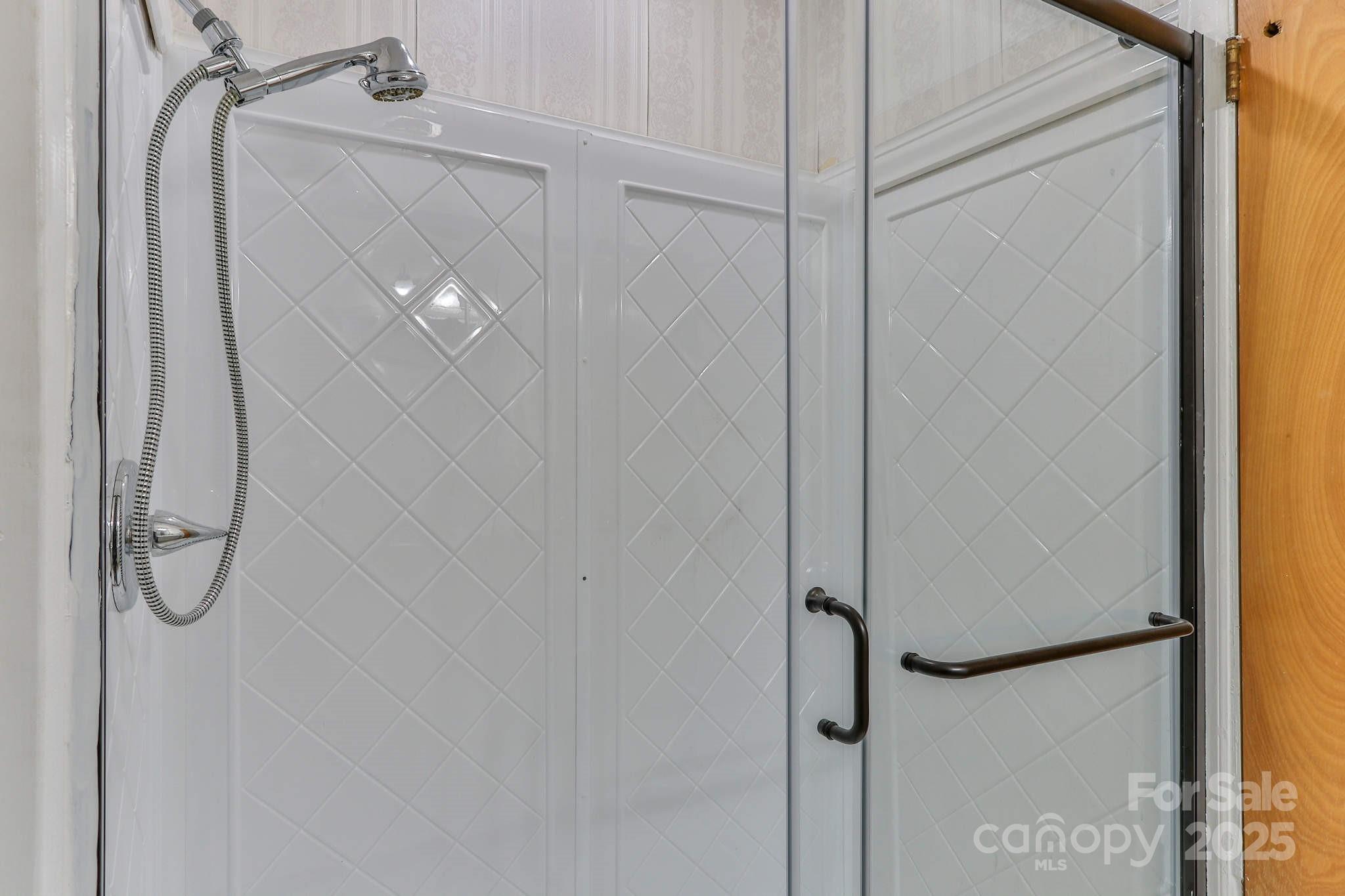 554 Wildlife Access Road Hickory, NC 28601 - Photo 23 of 34 a bathroom with a glass shower door