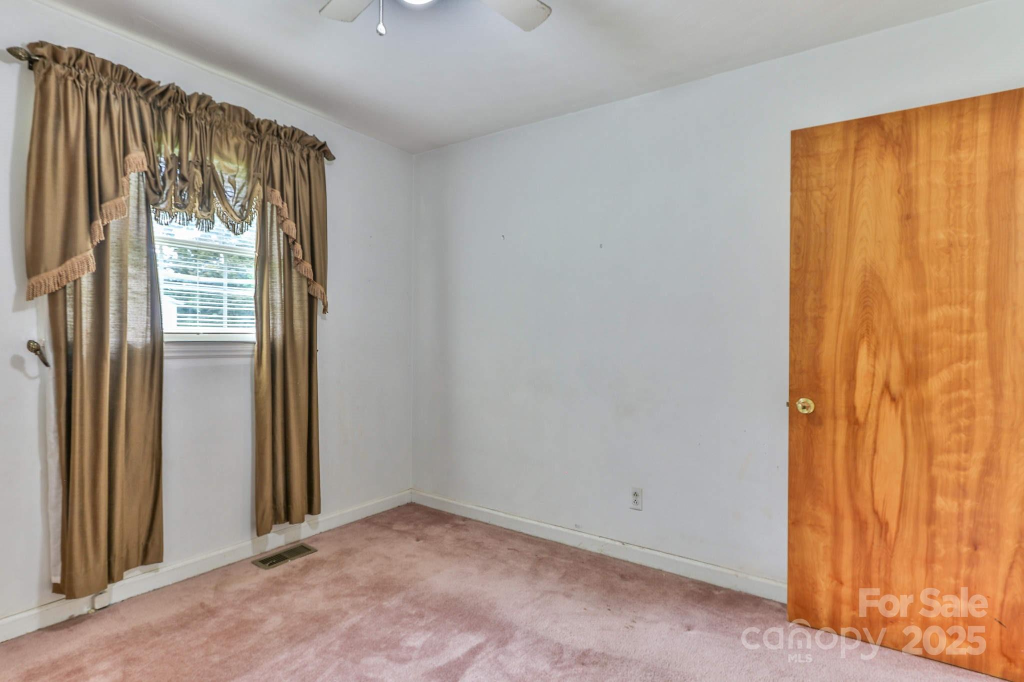 554 Wildlife Access Road Hickory, NC 28601 - Photo 25 of 34 an empty room with windows