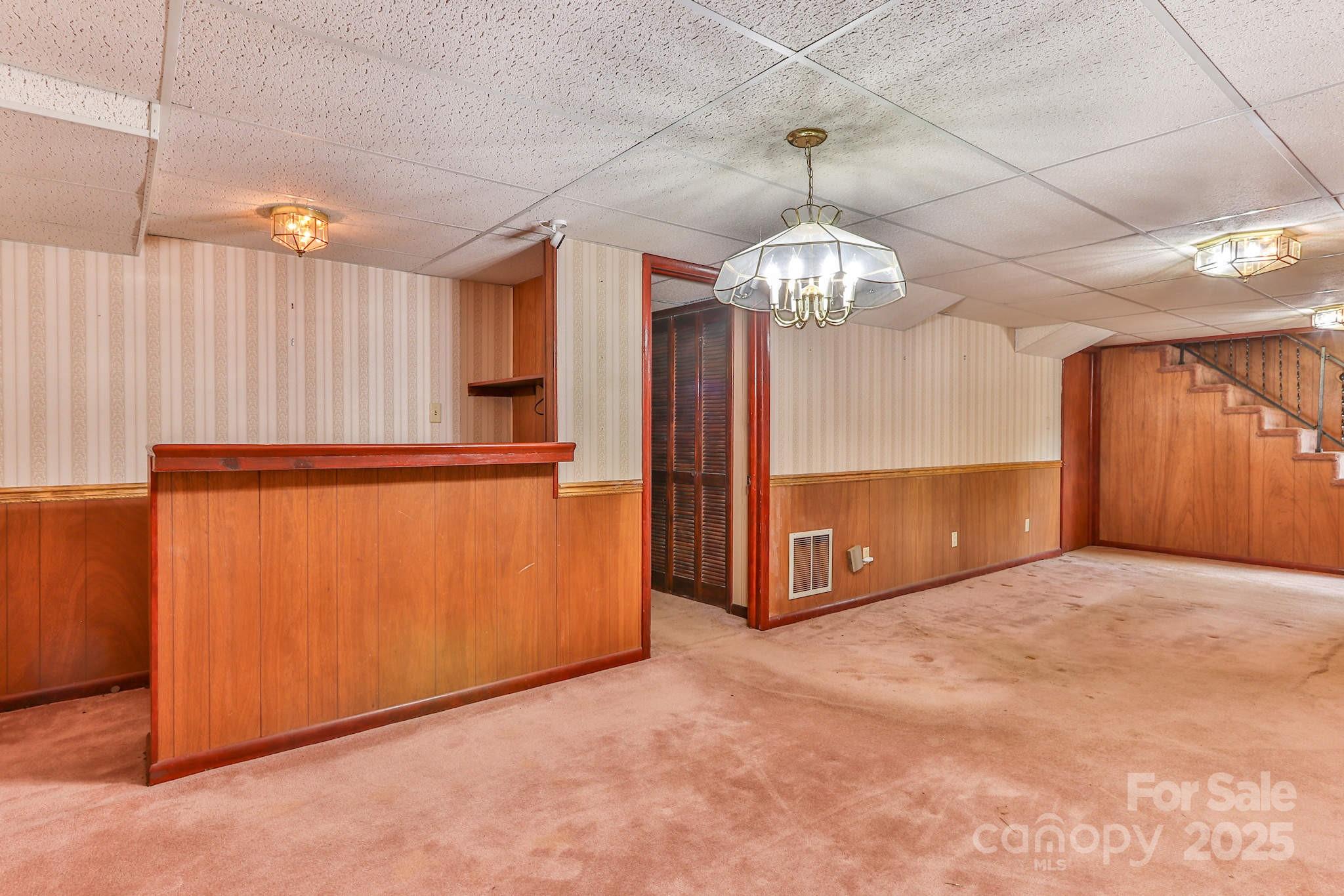 554 Wildlife Access Road Hickory, NC 28601 - Photo 27 of 34 a view of an empty room with a chandelier