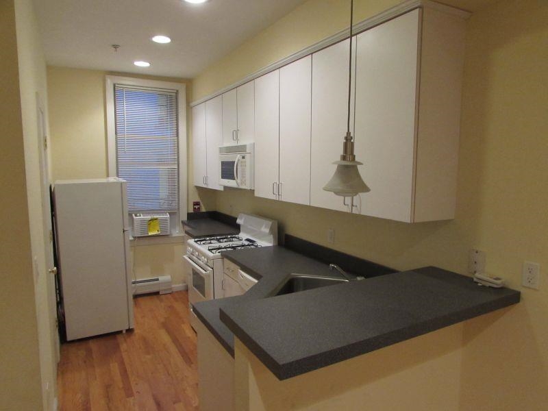358 3rd Street, Unit 3R Hoboken, NJ 07030 - Photo 1 of 8 a kitchen with a sink and a refrigerator