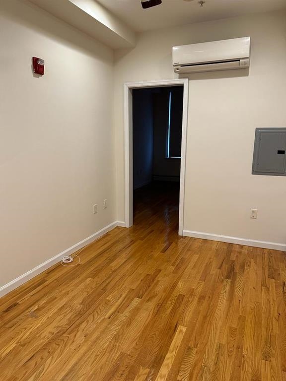 358 3rd Street, Unit 3R Hoboken, NJ 07030 - Photo 3 of 8 a view of an empty room with wooden floor
