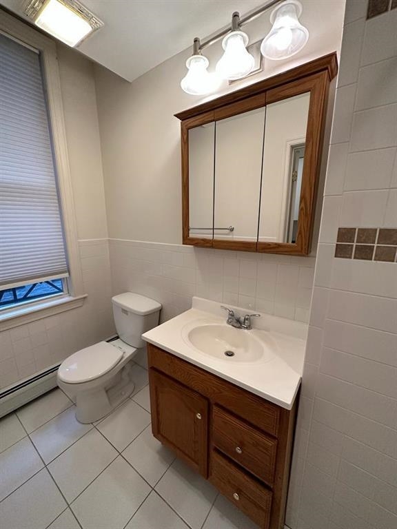 358 3rd Street, Unit 3R Hoboken, NJ 07030 - Photo 6 of 8 a bathroom with a sink toilet and mirror