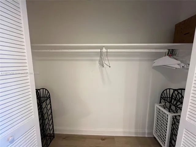 a view of a hallway with a window