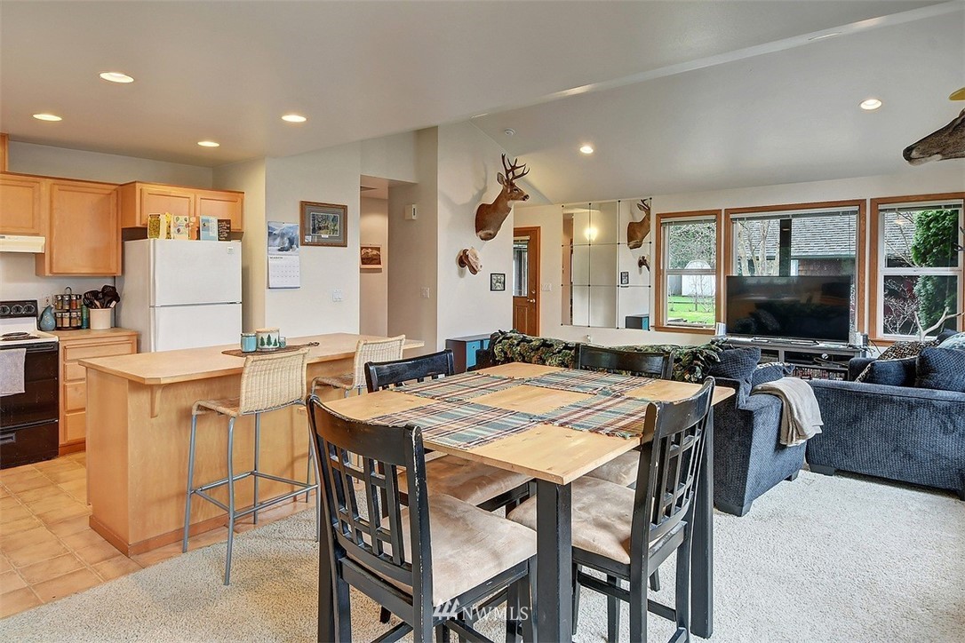 15921 179th Avenue Southeast Monroe, WA 98272 - Photo 15 of 27 a view of a dining room with furniture