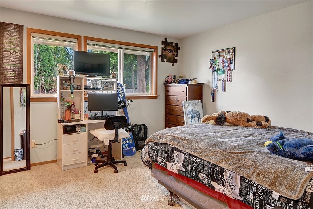 15921 179th Avenue Southeast Monroe, WA 98272 - Photo 18 of 27 a bedroom with furniture and a flat screen tv
