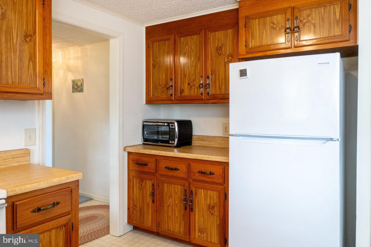 1529 Goodrich Road Stanley, VA 22851 - Photo 11 of 42 a kitchen with a refrigerator and a stove