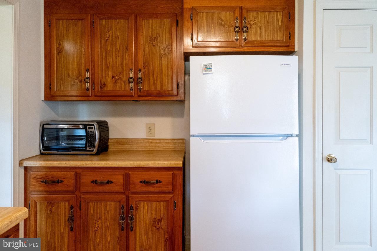 1529 Goodrich Road Stanley, VA 22851 - Photo 12 of 42 a kitchen with stainless steel appliances granite countertop a refrigerator and a stove top oven