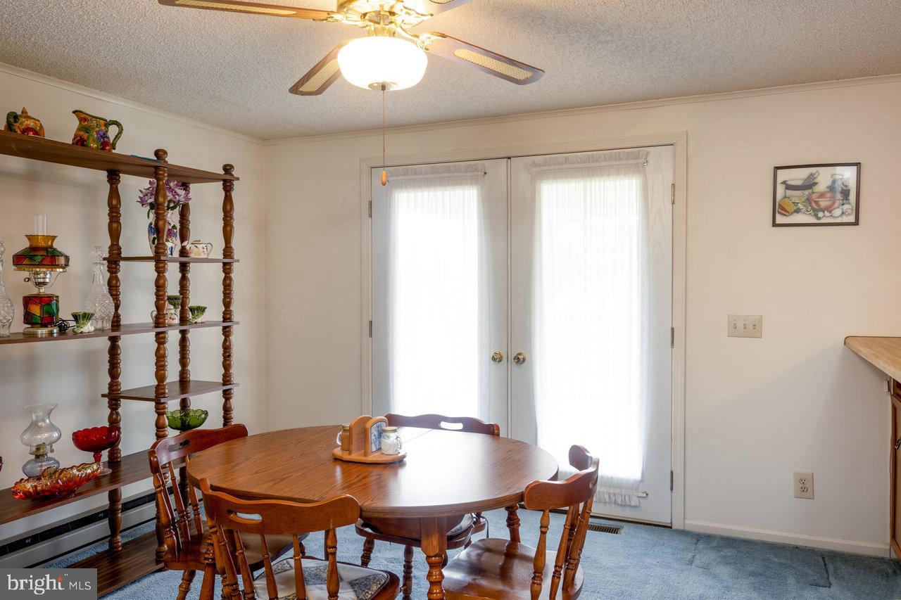 1529 Goodrich Road Stanley, VA 22851 - Photo 15 of 42 a view of a dining room with furniture and chandelier