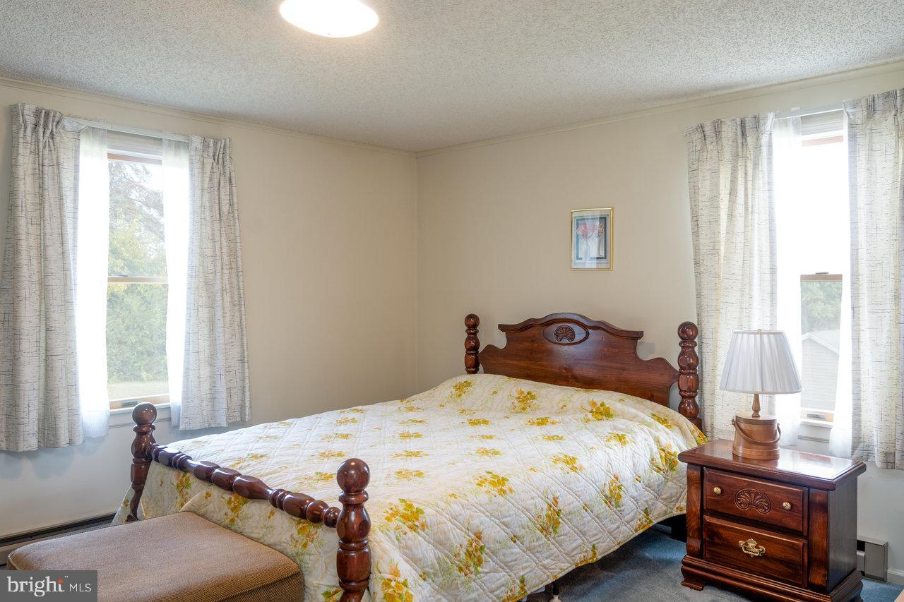 1529 Goodrich Road Stanley, VA 22851 - Photo 17 of 42 a bedroom with a bed and a window