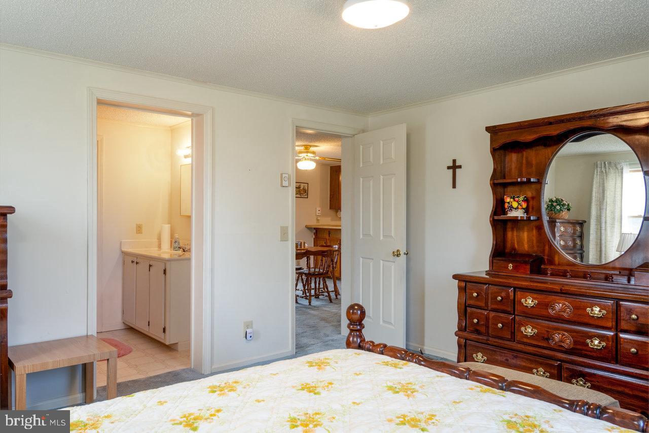 1529 Goodrich Road Stanley, VA 22851 - Photo 18 of 42 a view of a hallway with entryway wooden floor and cabinet