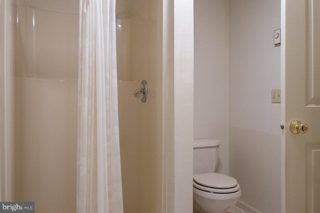 1529 Goodrich Road Stanley, VA 22851 - Photo 21 of 42 a white toilet sitting next to a shower