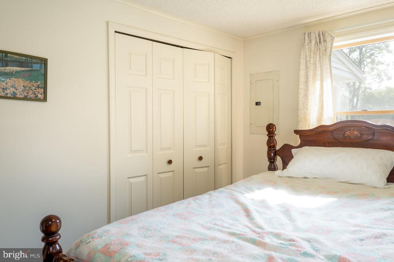 1529 Goodrich Road Stanley, VA 22851 - Photo 24 of 42 a bedroom with a bed and a window