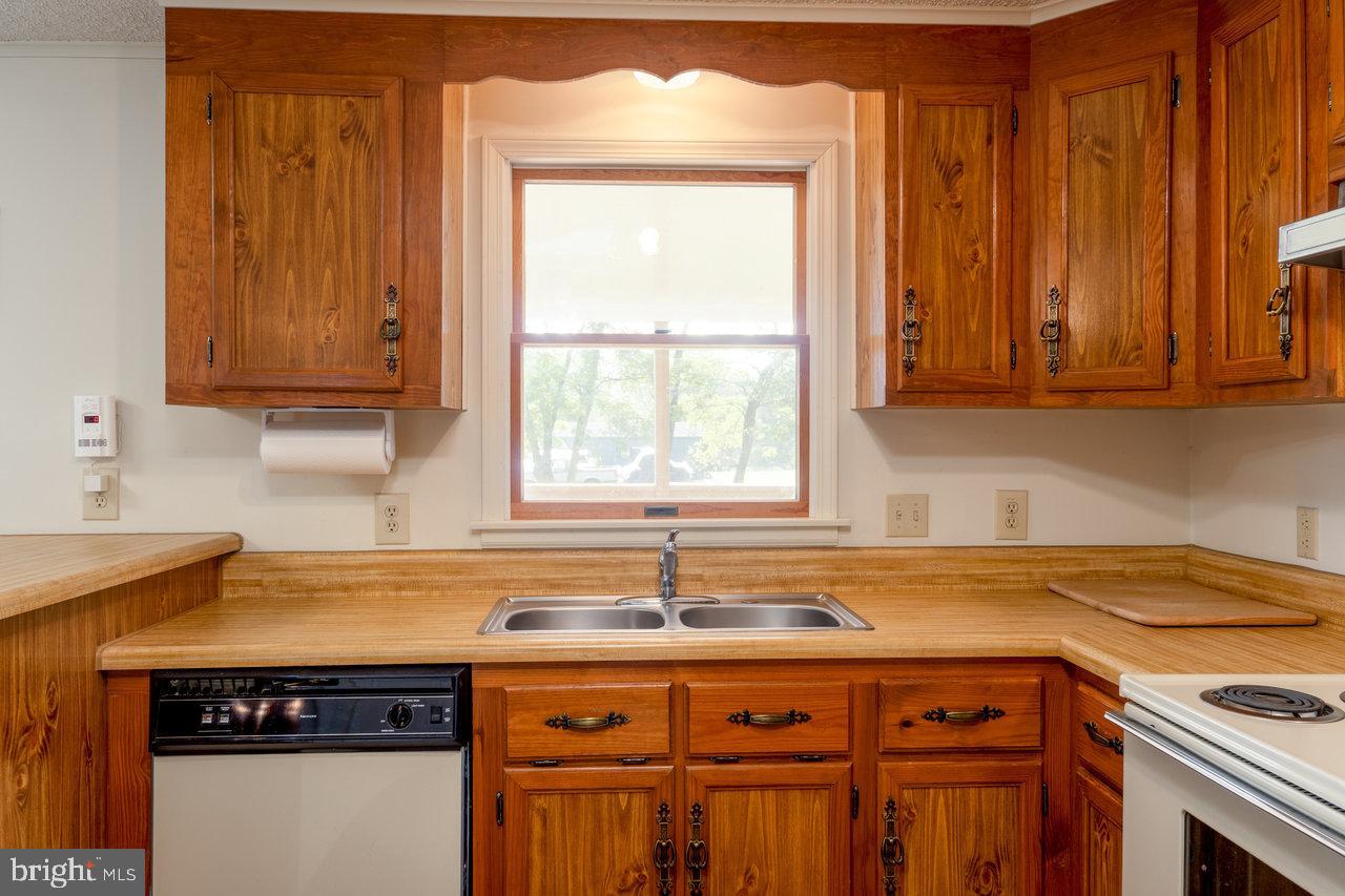 1529 Goodrich Road Stanley, VA 22851 - Photo 9 of 42 a kitchen with granite countertop a sink and a window