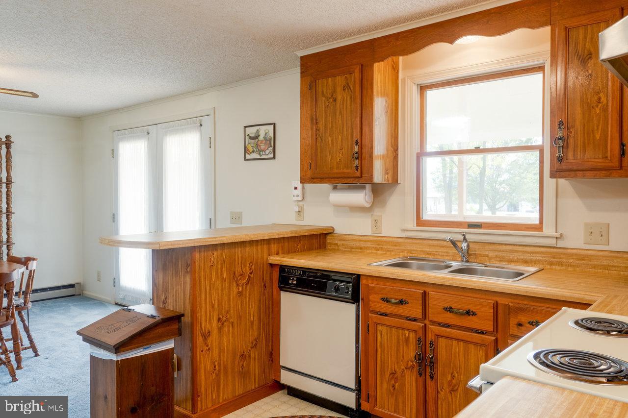 1529 Goodrich Road Stanley, VA 22851 - Photo 10 of 42 a kitchen with stainless steel appliances granite countertop a sink and a window