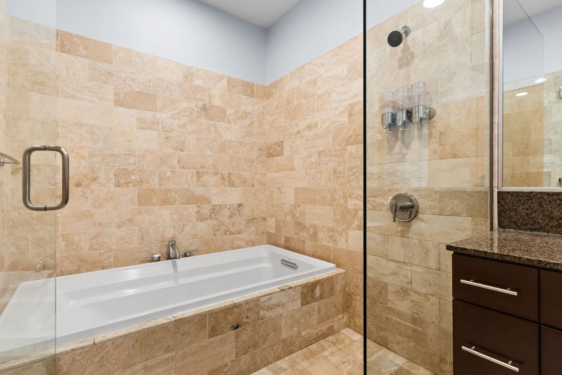 1600 Barton Springs Road, Unit 4602 Austin, TX 78704 - Photo 18 of 39 a bathroom with a bathtub and a shower