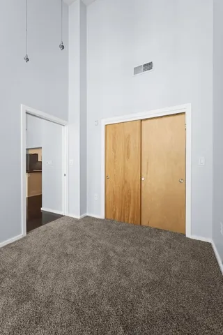 a view of an empty room with a window