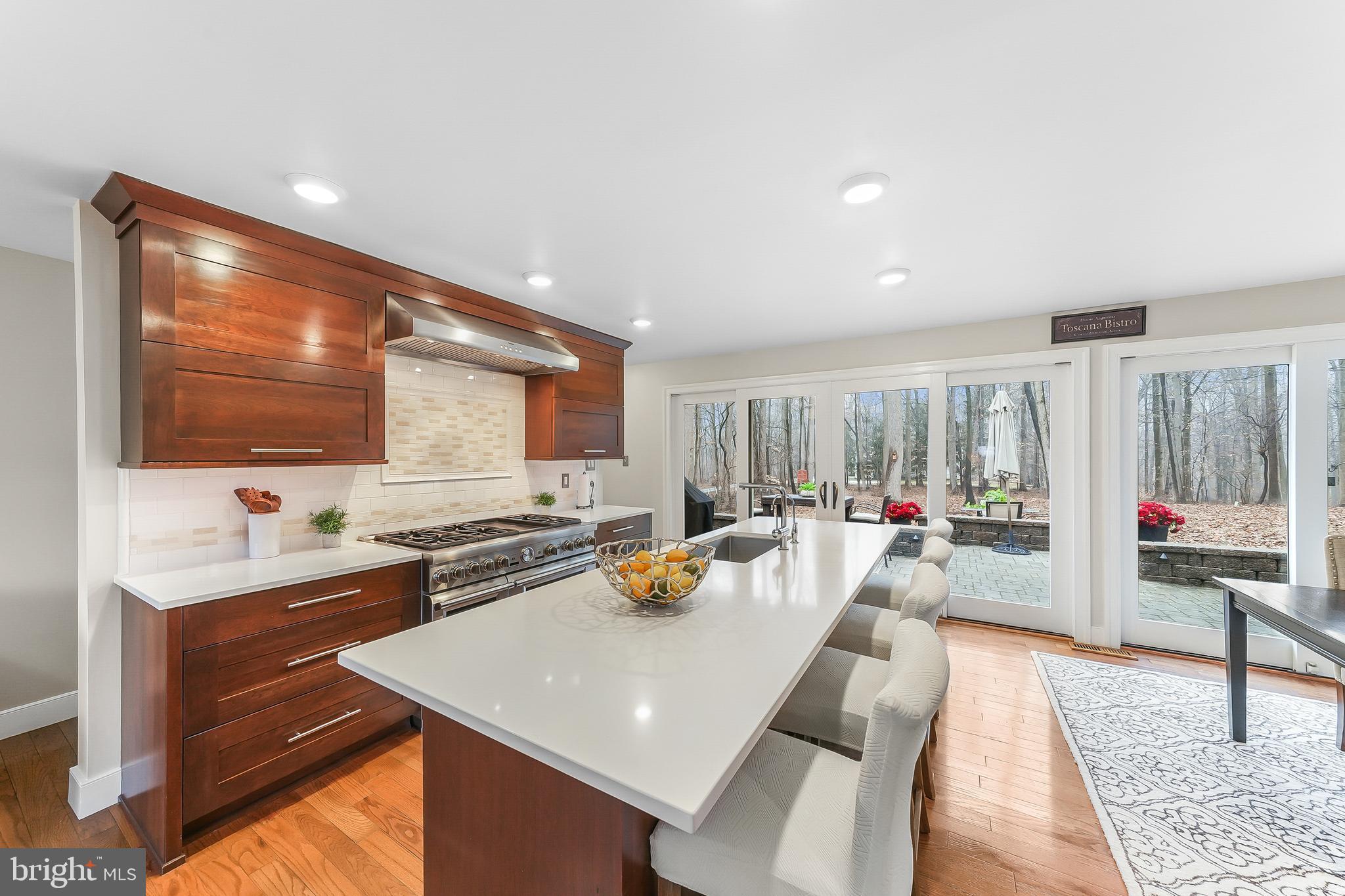 535 Webb Road Chadds Ford, PA 19317 - Photo 11 of 49 a kitchen with a sink a counter top space and living room view