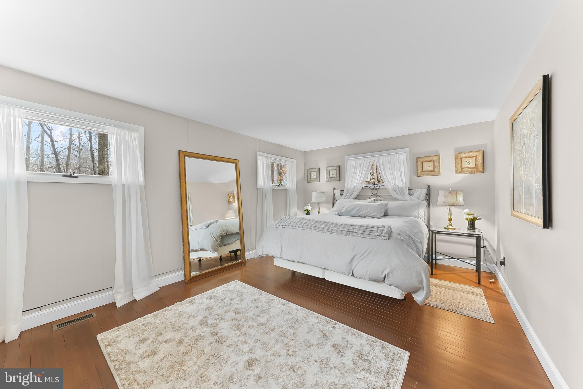 535 Webb Road Chadds Ford, PA 19317 - Photo 22 of 49 a bedroom with a bed and wooden floor