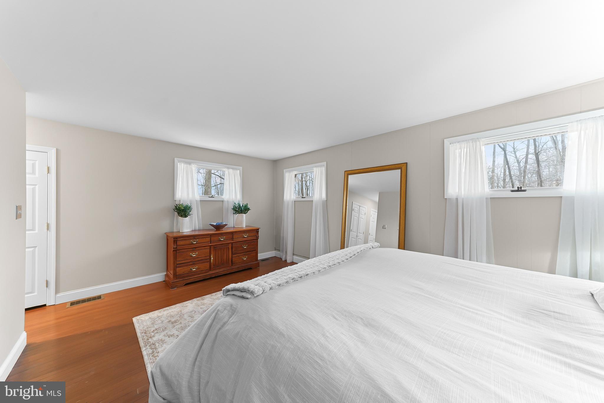 535 Webb Road Chadds Ford, PA 19317 - Photo 23 of 49 a bedroom with a bed and a dresser