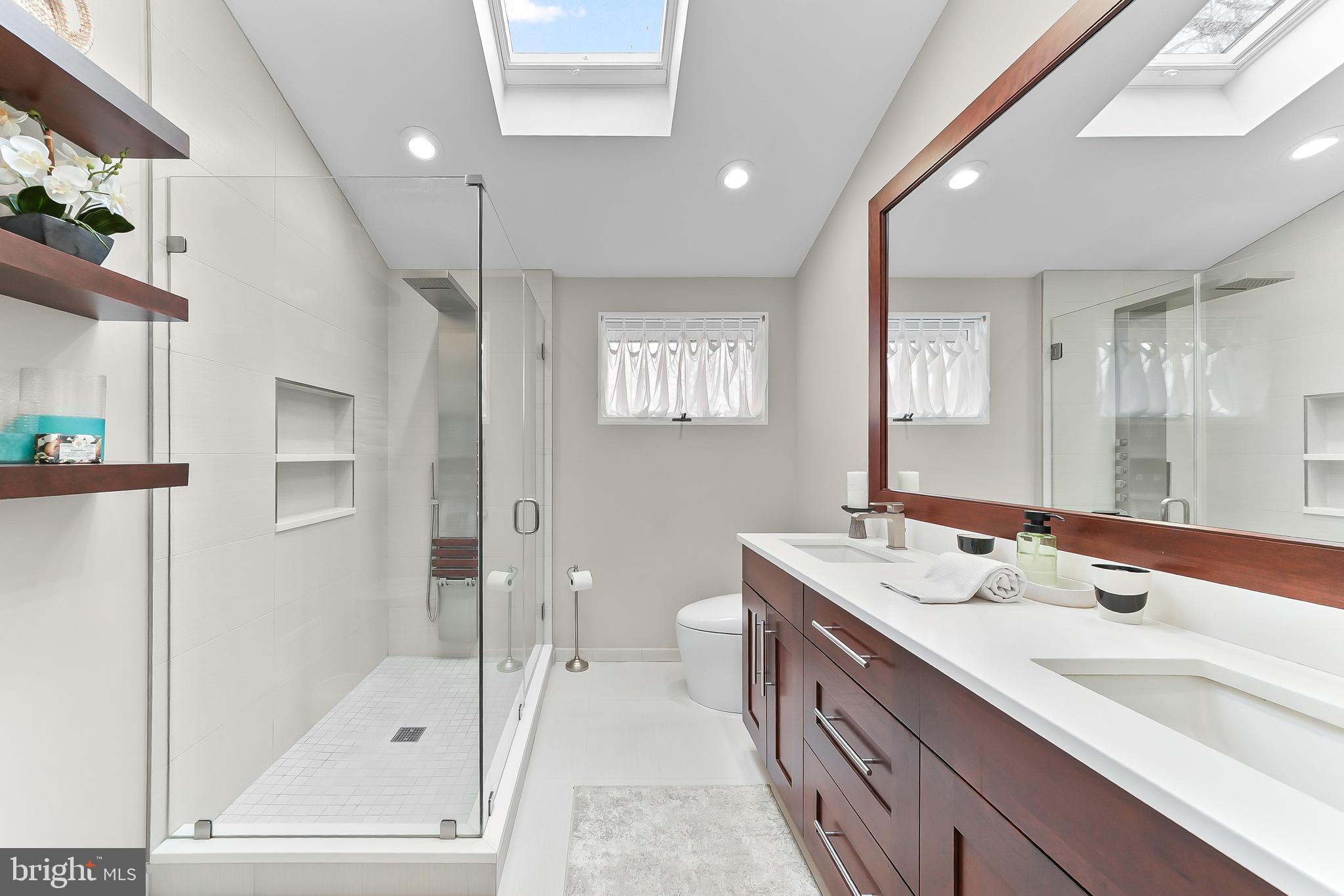 535 Webb Road Chadds Ford, PA 19317 - Photo 24 of 49 a bathroom with a double vanity sink mirror and shower