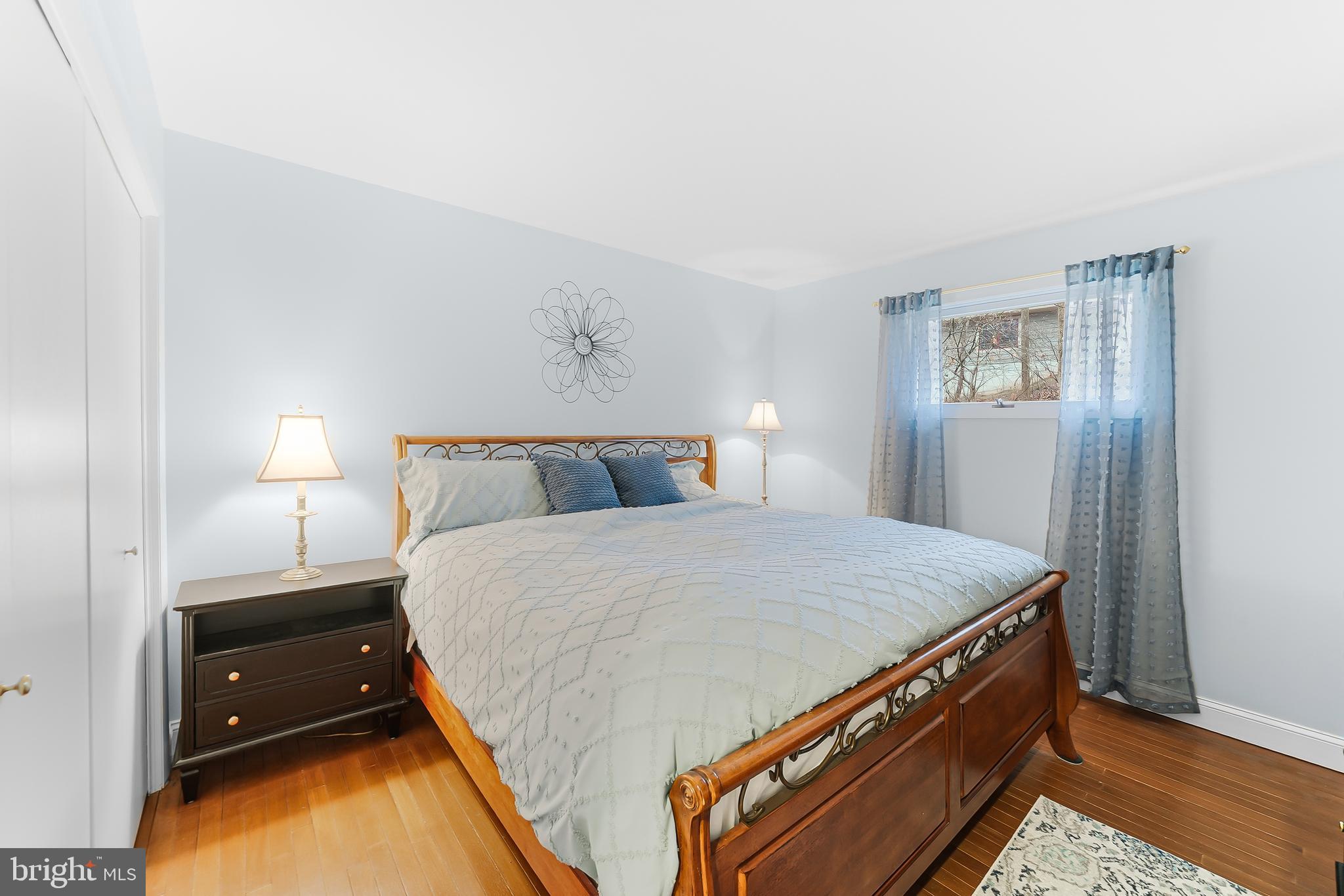 535 Webb Road Chadds Ford, PA 19317 - Photo 28 of 49 a bed room with a bed and a lamp