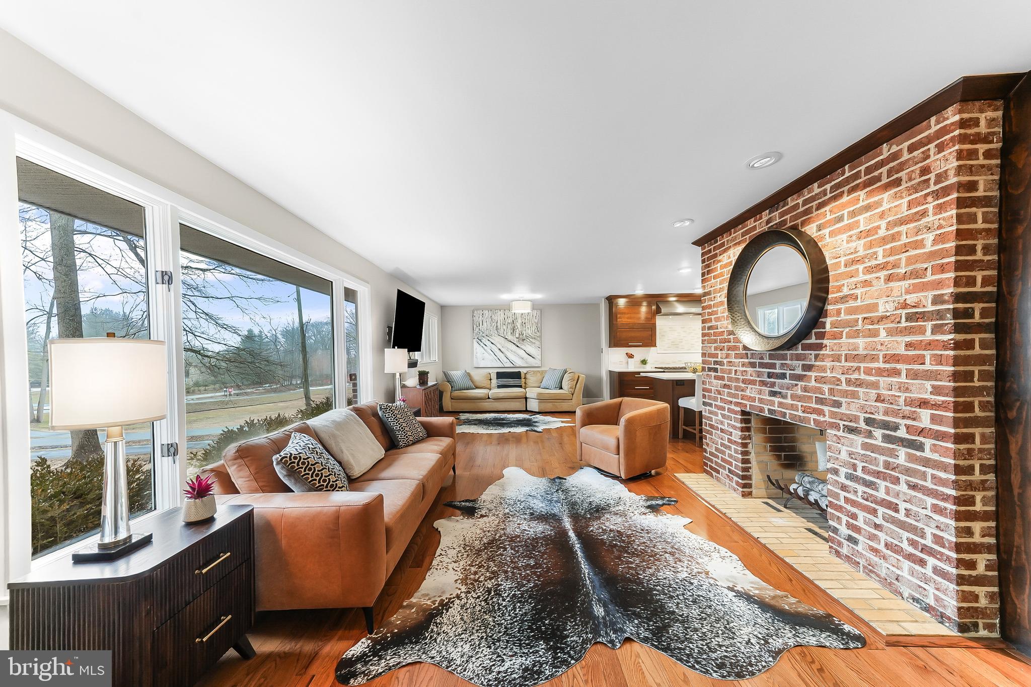 535 Webb Road Chadds Ford, PA 19317 - Photo 4 of 49 a living room with furniture a fireplace and a large window
