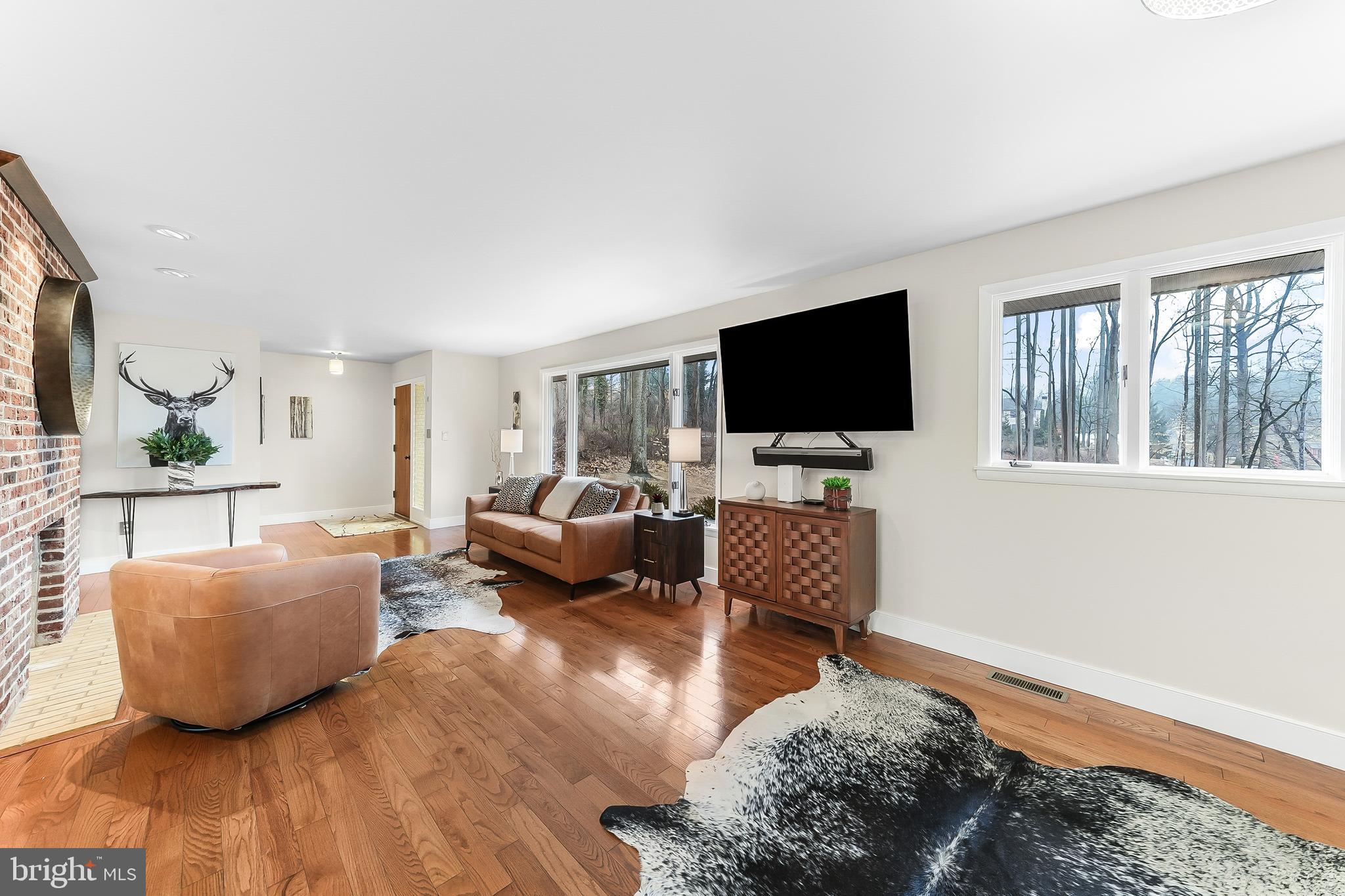 535 Webb Road Chadds Ford, PA 19317 - Photo 7 of 49 a living room with furniture and a flat screen tv