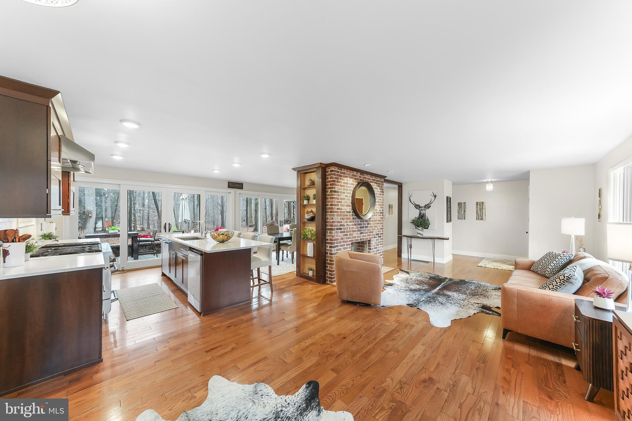535 Webb Road Chadds Ford, PA 19317 - Photo 8 of 49 a living room with furniture a dining table and chairs with wooden floor