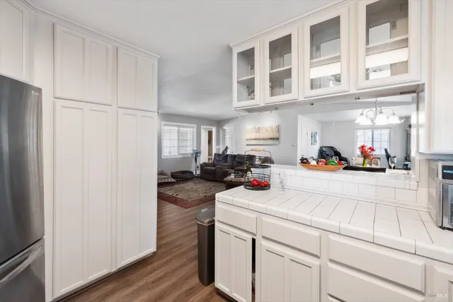 a bedroom with a bed and a ceiling fan