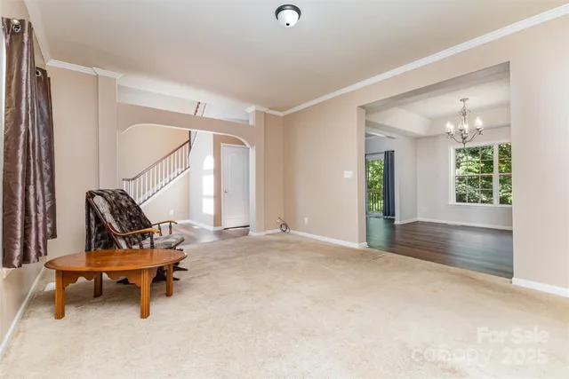 a view of a room with gym equipment and a large window