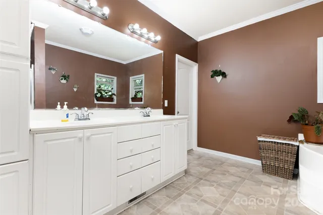 a bathroom with a sink a vanity and a mirror