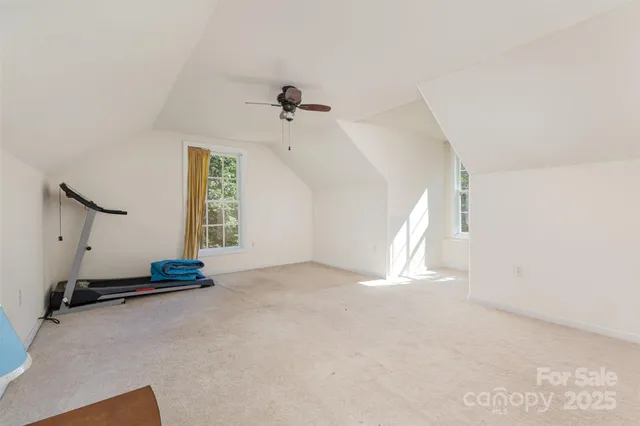 a view of empty room with windows