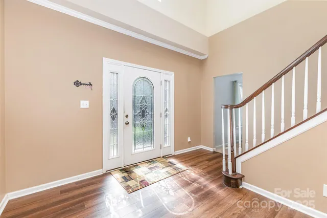 a view of entryway with wooden floor