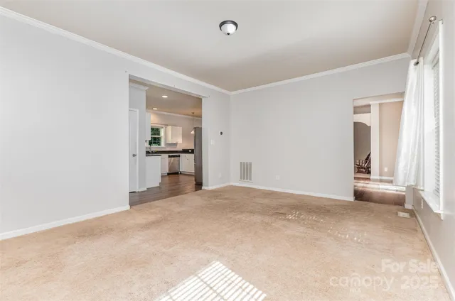 a view of a kitchen with a sink and a refrigerator