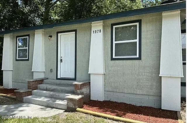 a front view of a house with outdoor space