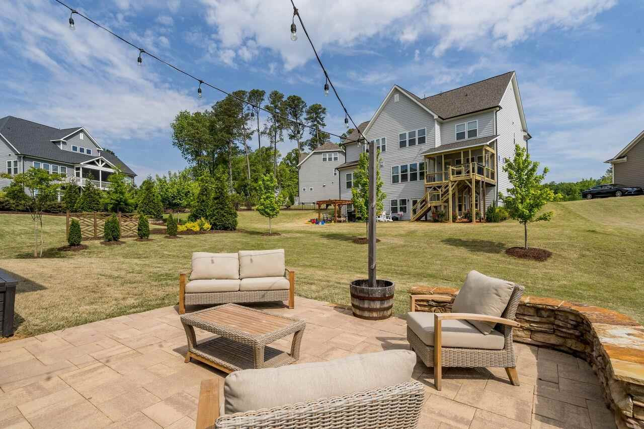 5264 Aleppo Lane Raleigh, NC 27613 - Photo 28 of 30 Paver patio out back expands your outdoor living space. Patio