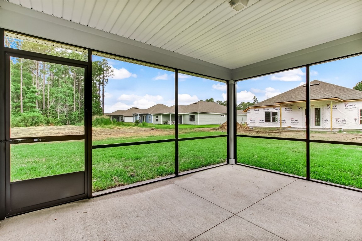 96735 Quartz Lane Yulee, FL 32097 - Photo 18 of 66 Patio- today there is a fence hiding those houses in background