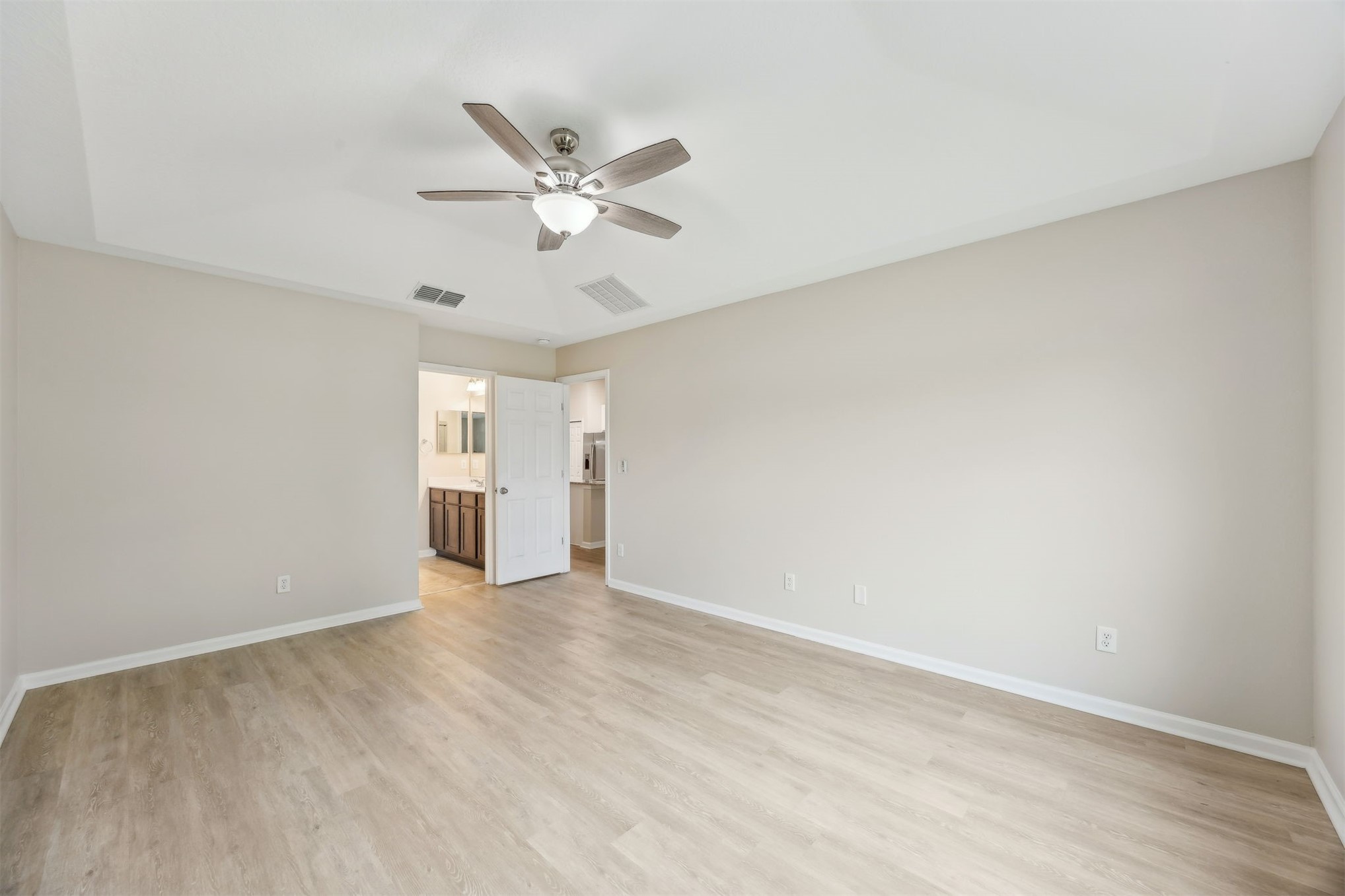 96735 Quartz Lane Yulee, FL 32097 - Photo 28 of 61 Primary suite to bathroom