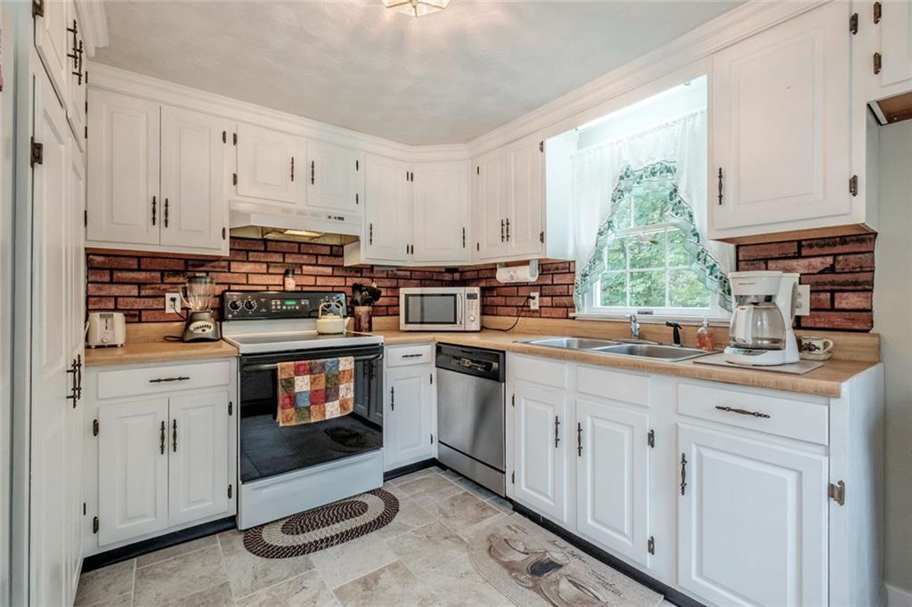 100 Sanborn Road Fryeburg, ME 04037 - Photo 6 of 35 Kitchen with new tile and painted...