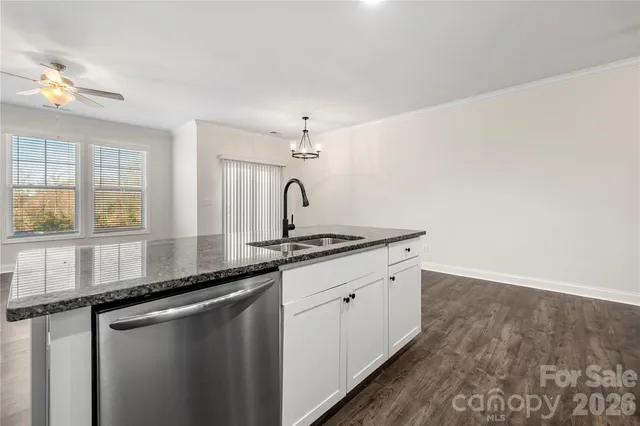a kitchen with a sink and a window